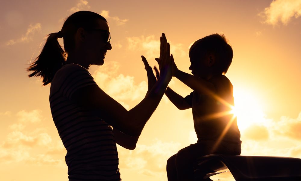 Mother and child at sunset representing family law and custody matters